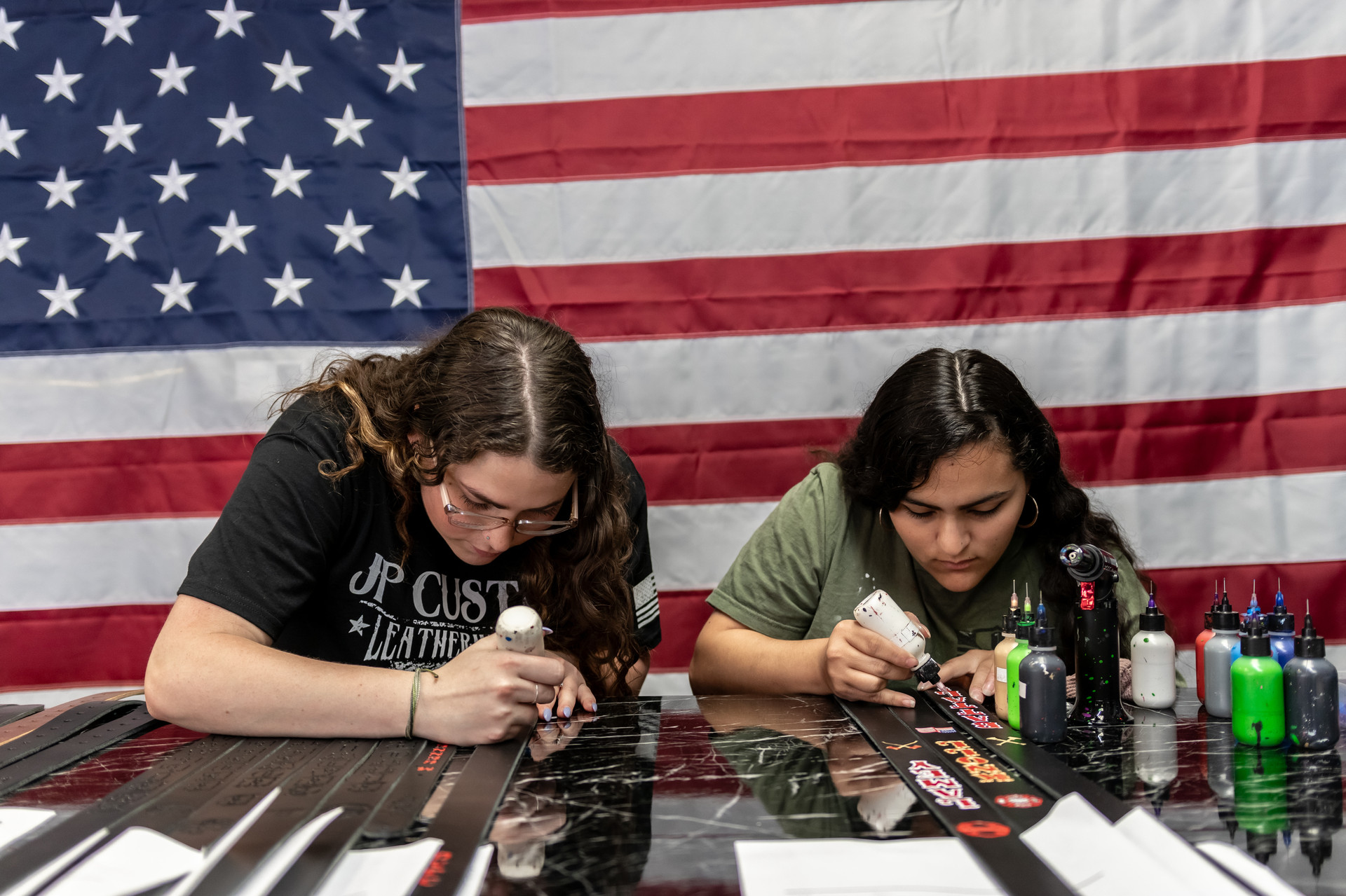 Hand-painting custom lettering on radio straps